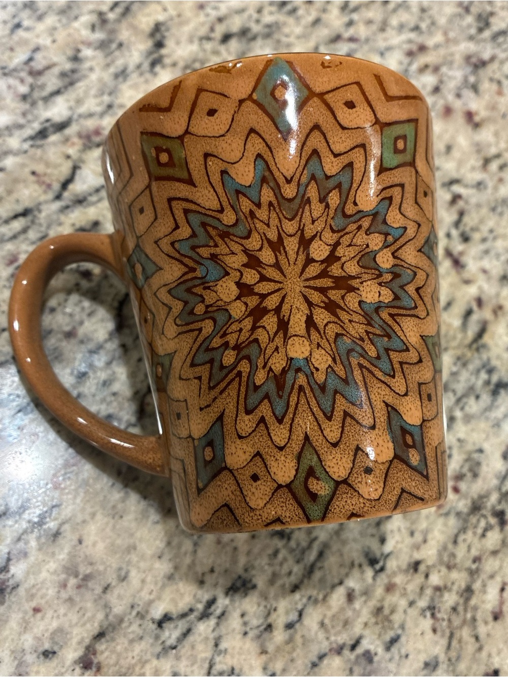 Handcrafted Ceramic Mug with Brown and Blue Starburst Design